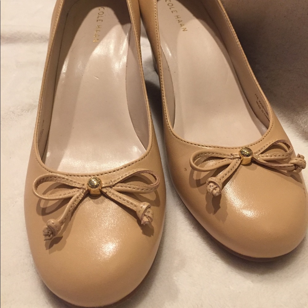 Cole Haan ballerina wedges in nude leather.
